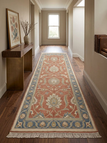 Runner rug, Hand Knotted Oushak Runner Rug, terracotta wool with ivory floral vines and a blue patterned border and fringe.