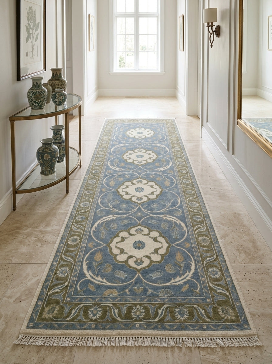 Hand Knotted Oushak Runner Rug in light blue wool, with ivory floral medallions, olive green vine border and fringe.