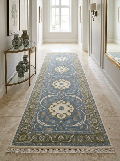 Hand Knotted Oushak Runner Rug in light blue wool, with ivory floral medallions, olive green vine border and fringe.