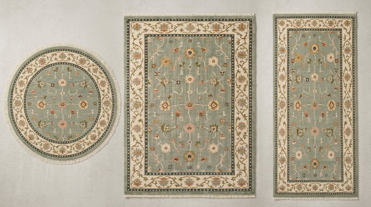Oushak Hand Knotted Rug in muted sage green wool, with scattered floral motifs, an ivory vine border and teal guard bands.