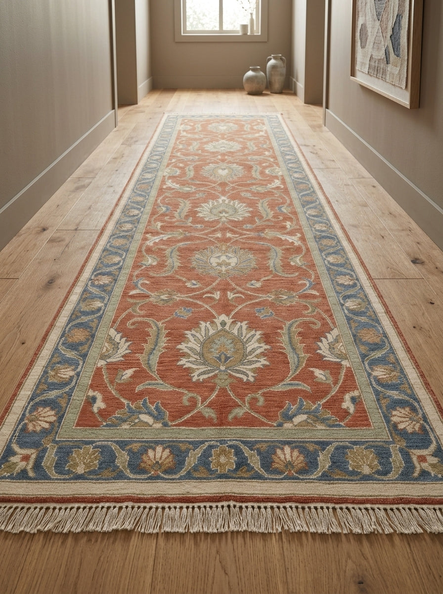 Hand Knotted Oushak Runner Rug in terracotta wool, with ivory floral vines, sage accents, blue border and fringe.