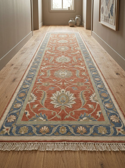 Hand Knotted Oushak Runner Rug in terracotta wool, with ivory floral vines, sage accents, blue border and fringe.