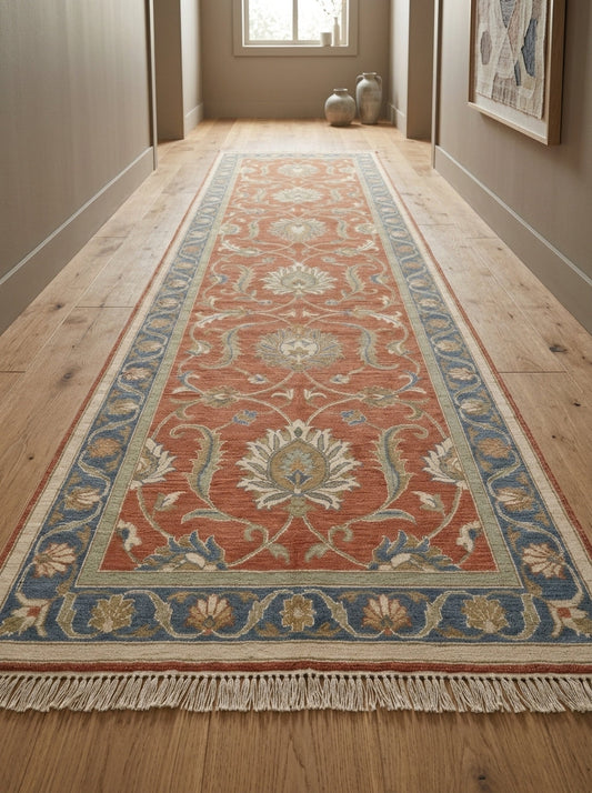Hand Knotted Oushak Runner Rug in terracotta wool, with ivory floral vines, sage accents, blue border and fringe.