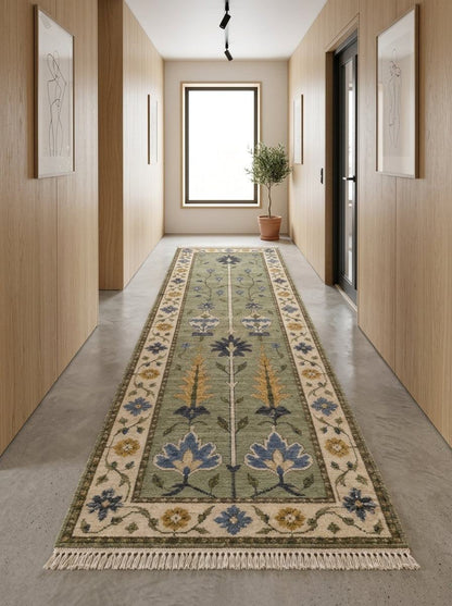 Hand Knotted Oushak Runner Rug in sage green wool, with blue and mustard floral motifs, ivory vine border and fringe.