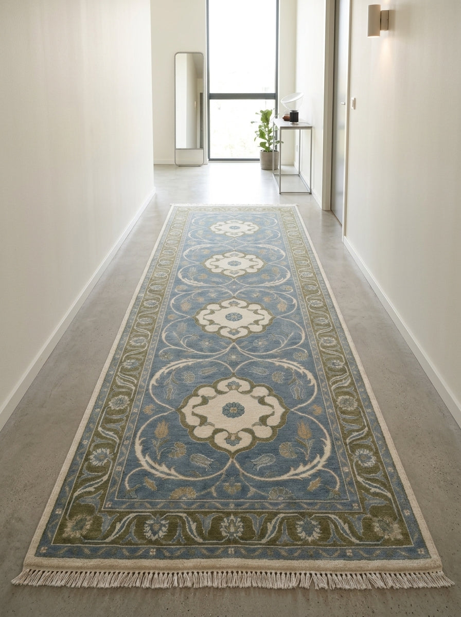 Hand Knotted Oushak Runner Rug in muted blue wool, with ivory floral medallions, olive vine borders and fringe.