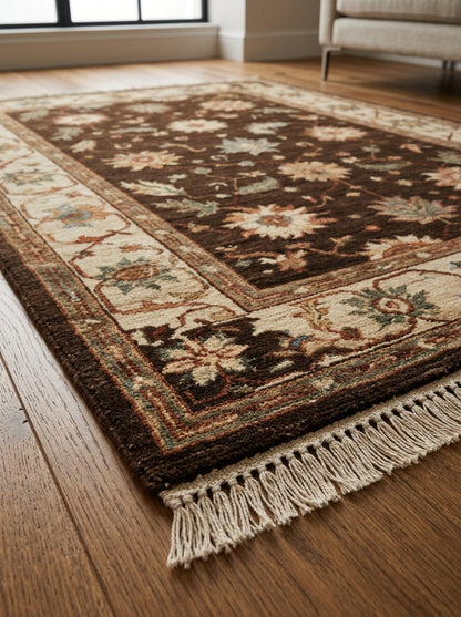 Oushak Hand Knotted Rug in espresso brown wool, with cream, rust and sage florals, beige scrolling border and fringe.