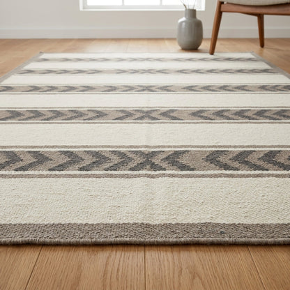 Southwestern Flatweave Wool Rug with ivory and taupe stripes, charcoal chevron bands, and a taupe border.