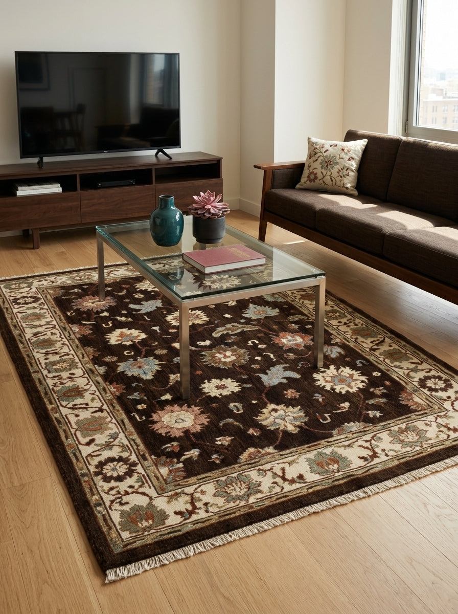 Oushak Hand Knotted Rug in chocolate brown wool, with multicoloured floral motifs, an ivory palmette border and fringe.
