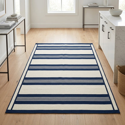 Southwestern Flatweave Wool Rug in ivory with navy blue wide stripes, fine pinstripes, and a framed border