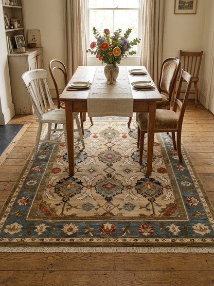 Oushak Hand Knotted Rug in camel beige wool, with a floral palmette lattice, slate blue border and fringe.