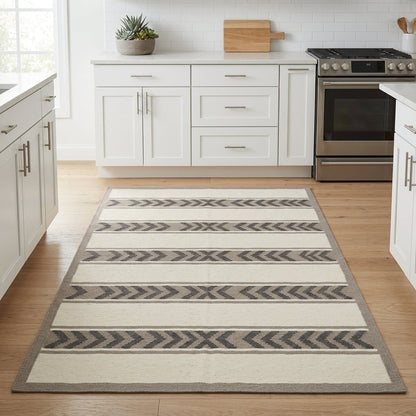 Southwestern Flatweave Wool Rug in ivory, taupe and charcoal, with striped chevron bands and a taupe border.