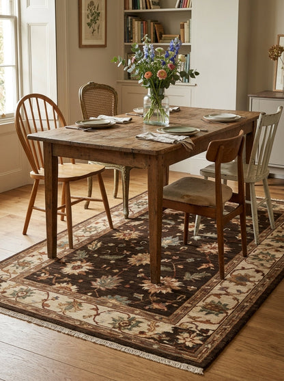 Oushak Hand Knotted Rug in espresso brown wool, with floral motifs, rust vines, a beige scrolling border and fringed ends.