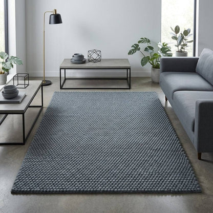 Chunky Wool Rug in slate blue-gray, with a thick woven surface of tightly spaced rounded pebble-like bumps.