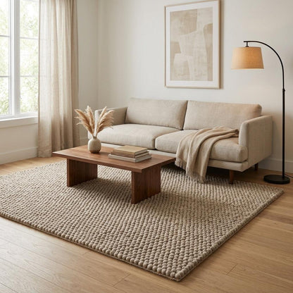 Chunky Wool Rug with a thick, hand-knotted pebble texture in a neutral taupe greige wool-style fiber blend.