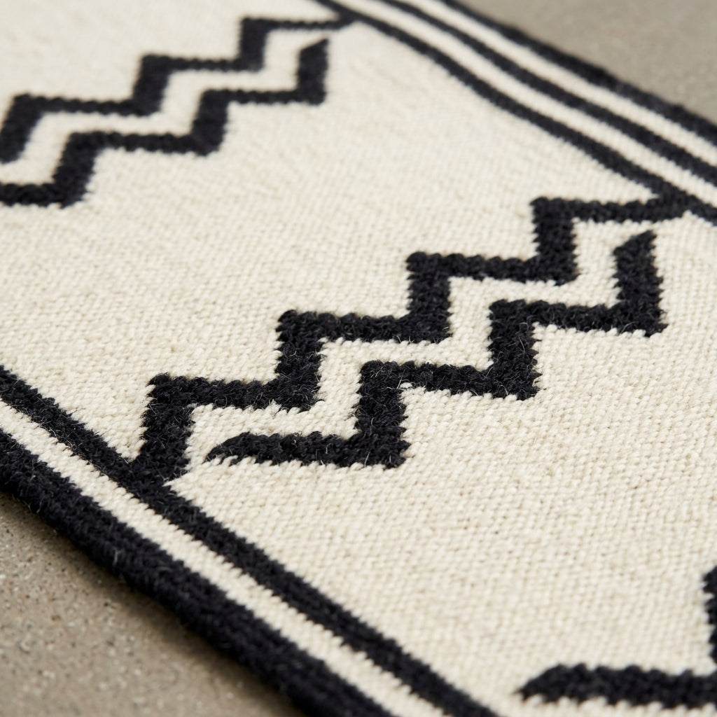 Hand Knotted Oushak Runner Rug in ivory wool, with bold black stepped zigzags and narrow geometric border detailing.