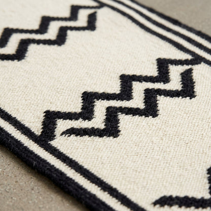 Hand Knotted Oushak Runner Rug in ivory wool, with bold black stepped zigzags and narrow geometric border detailing.