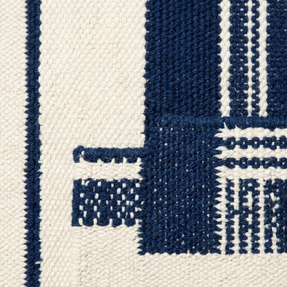 Southwestern Flatweave Wool Rug in navy and ivory, with bold stripes, fine pinstripes and textured woven details.