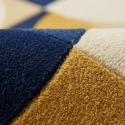 Hand tufted wool rug, Handmade Retro Rug with plush navy, mustard and ivory geometric quarter-circle blocks.