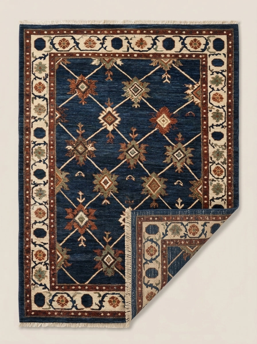 Oushak Hand Knotted Rug in deep navy wool, with an ivory diagonal lattice, rust and sage stars, and floral border.