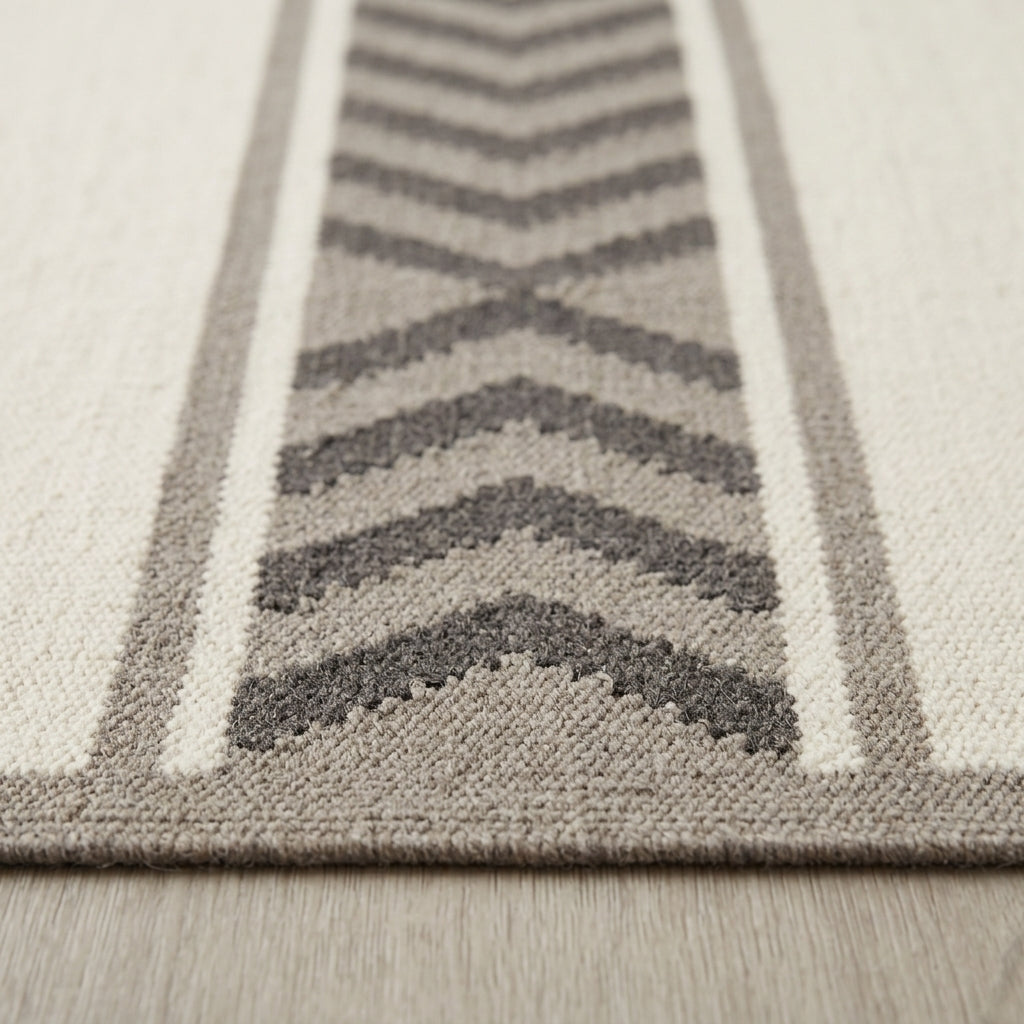 Southwestern Flatweave Wool Rug with ivory, taupe and charcoal chevron bands, textured woven surface and taupe border.
