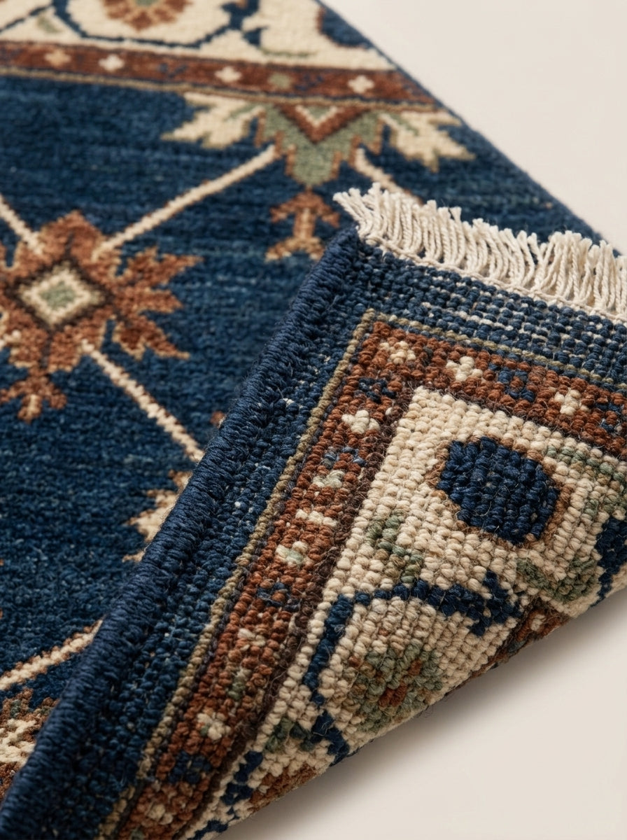 Oushak Hand Knotted Rug in navy wool, with ivory lattice, rust and sage star motifs, detailed border and fringe.