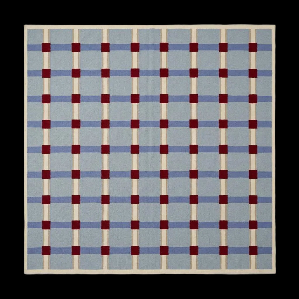 Pale blue flatweave wool rug with red grid check pattern, handwoven dhurrie for modern living room