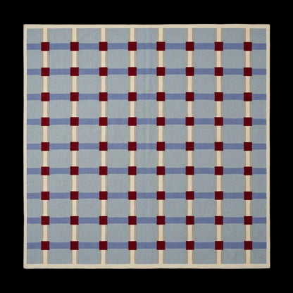 Pale blue flatweave wool rug with red grid check pattern, handwoven dhurrie for modern living room