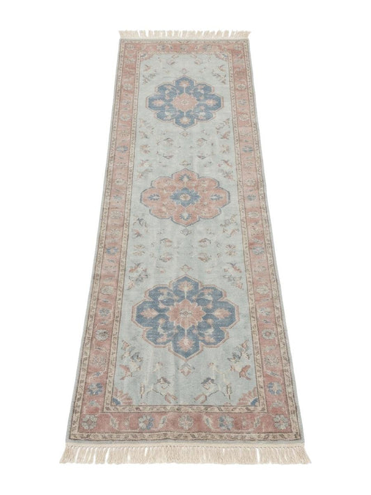 Pale Blue Oushak Runner Rug in faded blue-grey wool with slate blue and blush floral medallions, pink border and fringe