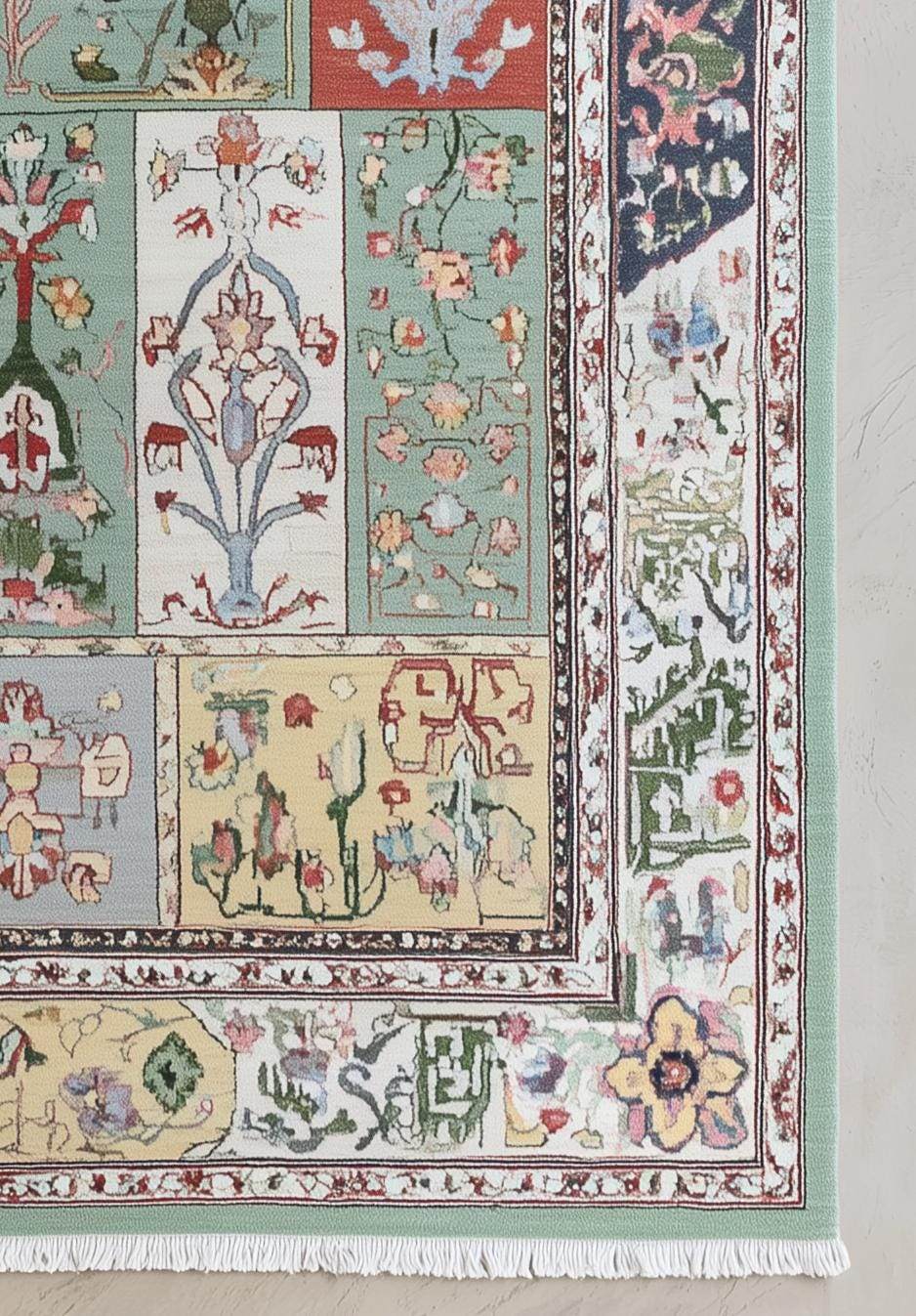 Pastel floral patchwork rug with mint, sage, and navy accents and white fringed edges in classic rectangular layout