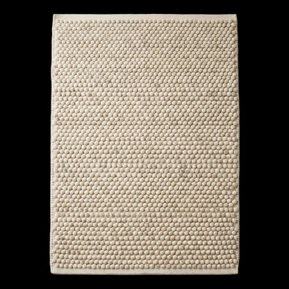 Handwoven pebble weave wool area rug in ivory beige with textured chunky loops for living room decor