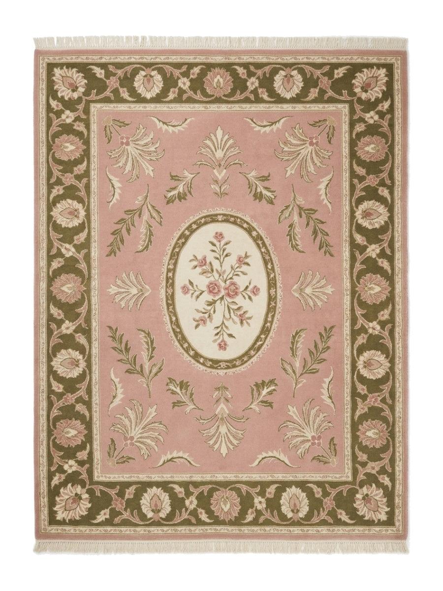 Pink Aubusson Rug featuring a blush pink wool field, ivory floral oval medallion, olive green floral border and fringe
