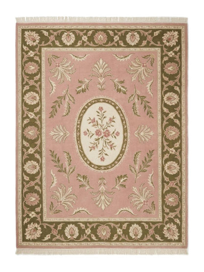Pink Aubusson Rug featuring a blush pink wool field, ivory floral oval medallion, olive green floral border and fringe