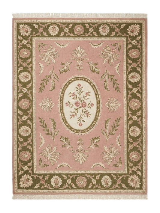 Pink Aubusson Rug featuring a blush pink wool field, ivory floral oval medallion, olive green floral border and fringe