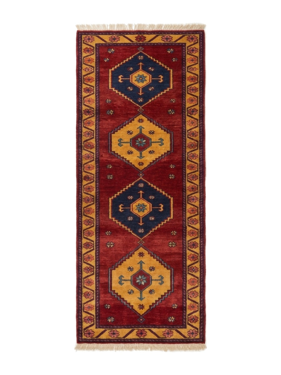 Red Tribal Runner Rug with a wine-red wool field, alternating navy and gold geometric medallions, and ornate golden rosette border