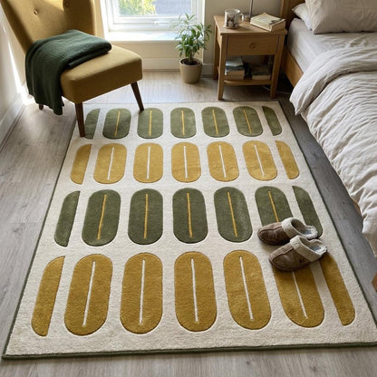 Retro Oval Rug in ivory wool with rows of olive green and mustard oval shapes, carved center lines and olive edging