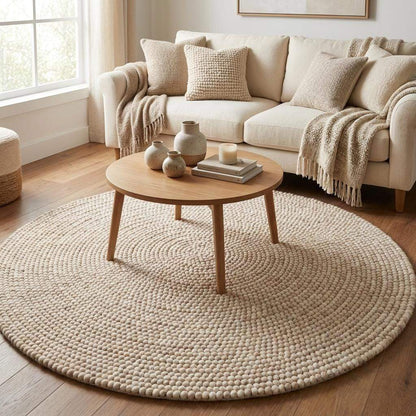 Handwoven round chunky knit wool rug in cream with Scandinavian minimalist design for cozy home décor