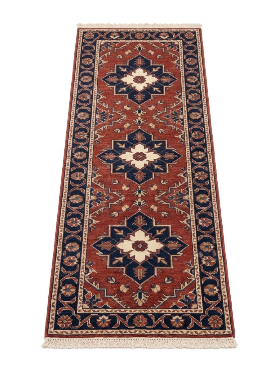 Rust Red Heriz Runner Rug in rust red wool with three navy and ivory geometric medallions and a floral border