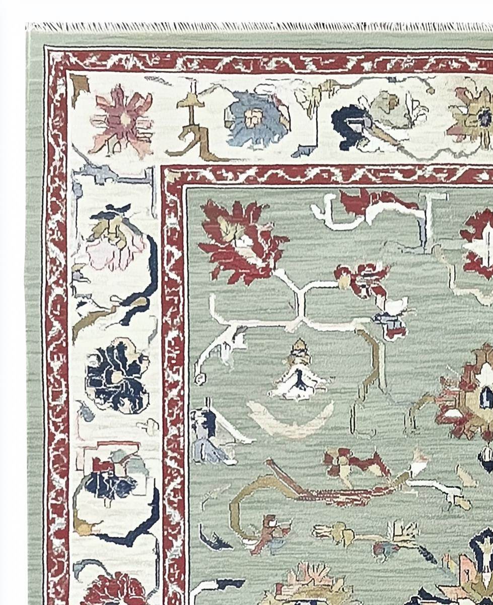 Sage green Oushak rug with floral and vine patterns, hand-tufted wool, muted terracotta border, soft vintage colors, perfect for living rooms and bedrooms
