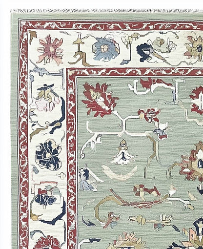 Sage green Oushak rug with floral and vine patterns, hand-tufted wool, muted terracotta border, soft vintage colors, perfect for living rooms and bedrooms