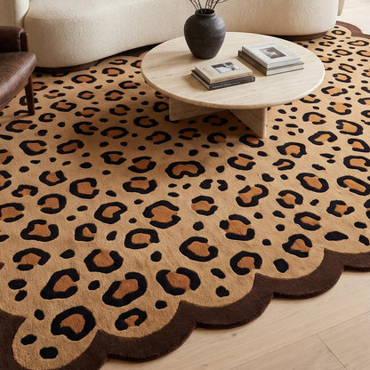 Scalloped Leopard Rug in tan wool with black and caramel rosettes and a dark brown wavy edge