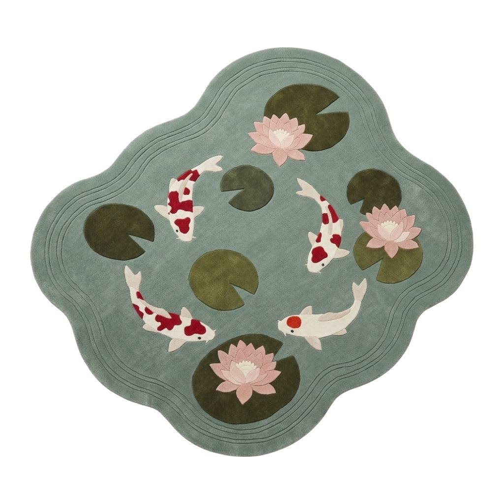 Seafoam Koi Fish Rug with a scalloped seafoam wool surface, red and white koi, olive lily pads and blush water lilies
