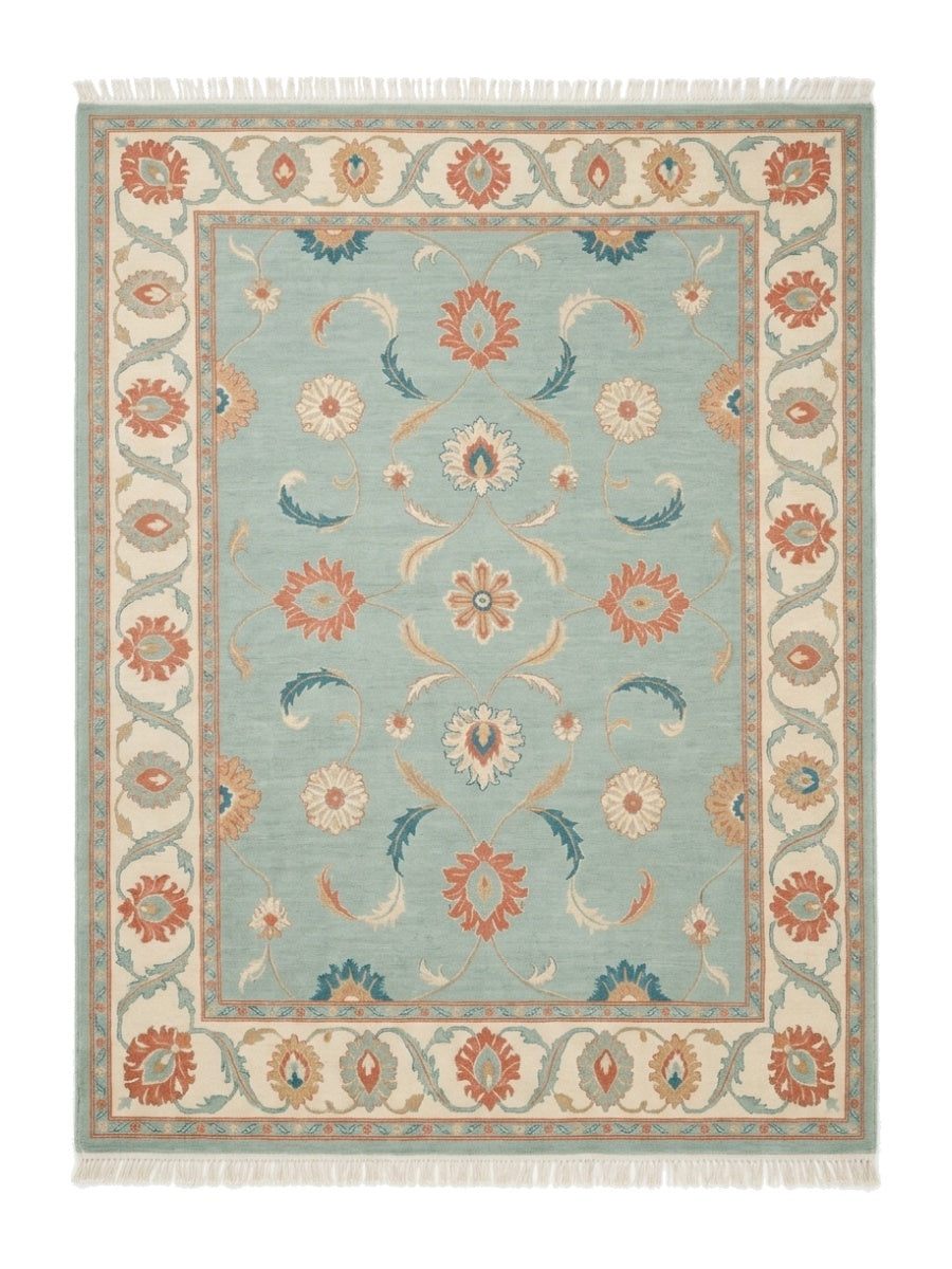Seafoam Oushak Rug in wool with coral and teal floral palmettes, an ivory border, and fringed ends
