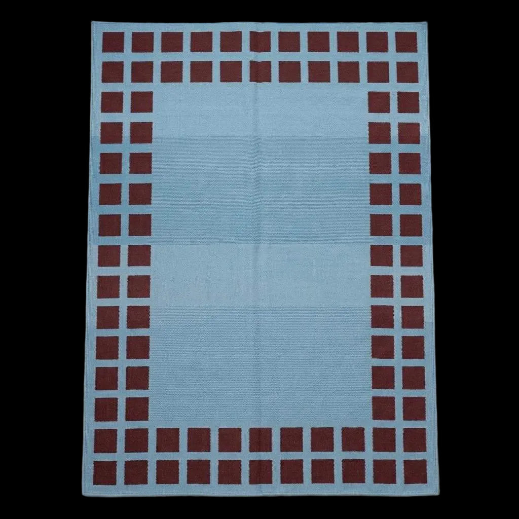 Handwoven sky blue dhurrie rug with maroon square border flatweave design