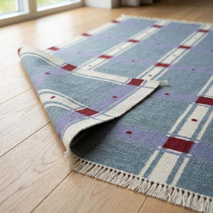 Slate blue plaid wool dhurrie flatweave rug with handwoven red check design
