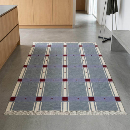 Slate blue plaid wool dhurrie rug with red check design, handwoven flatweave pattern