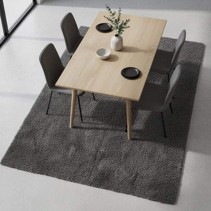 Soft plush grey rug with dense smooth pile in modern living room setting