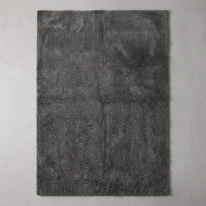 Modern grey plush area rug with smooth dense pile, styled in minimalist home interior with chair. __etsy:7548461153