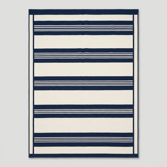 Southwestern Flatweave Wool Rug in navy and ivory, with bold horizontal bands, fine pinstripes, and a slim framed edge.