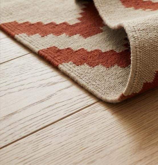 Southwestern flatweave wool rug with terracotta, turquoise, and geometric diamond patterns for living room decor