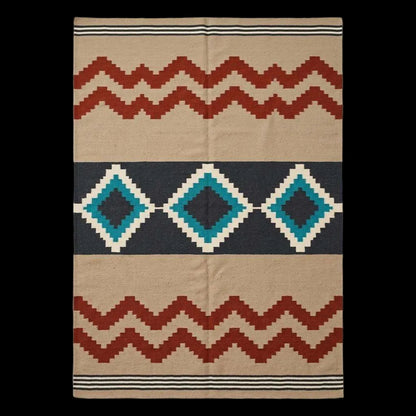 Southwestern flatweave wool rug with terracotta, turquoise, and geometric diamond design in living room setting